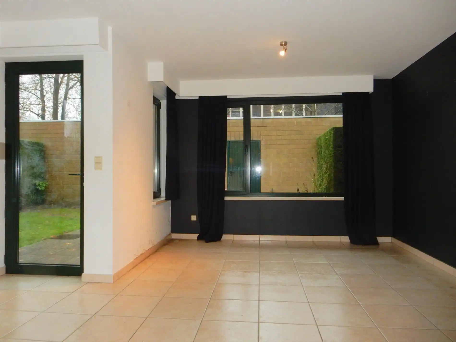 Gezellig gelijkvloersappartement met zonnige tuin en garage foto 3