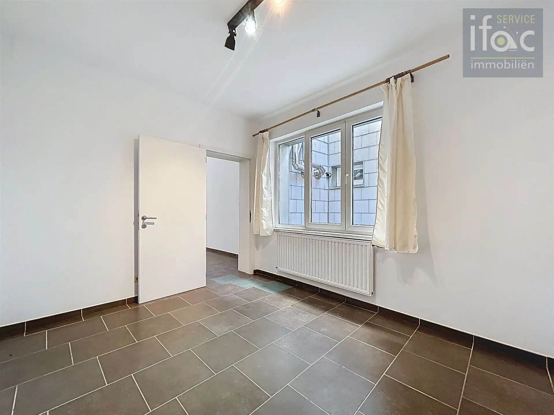 Gelijkvloers appartement met bergingszolder foto 6