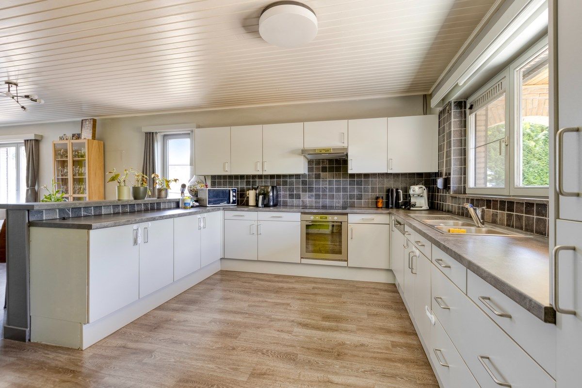 Rustig gelegen gelijkvloers woning met 2 slpks en ruime zolder. foto 7