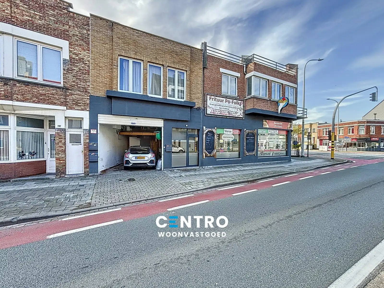 Woon- en handelshuis (handelszaak + 2 appartementen) met garage! foto {{pictureIndex}}