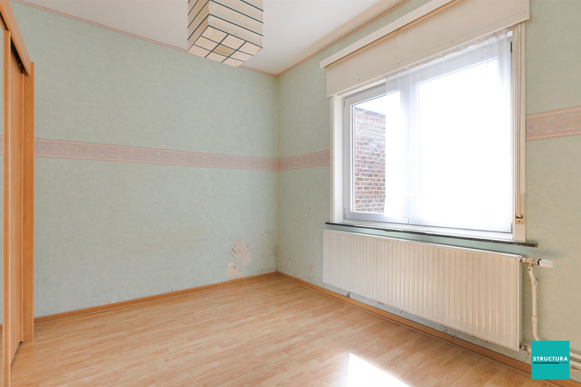 Opbrengsteigendom met 2 appartementen en 7 garageboxen foto 19