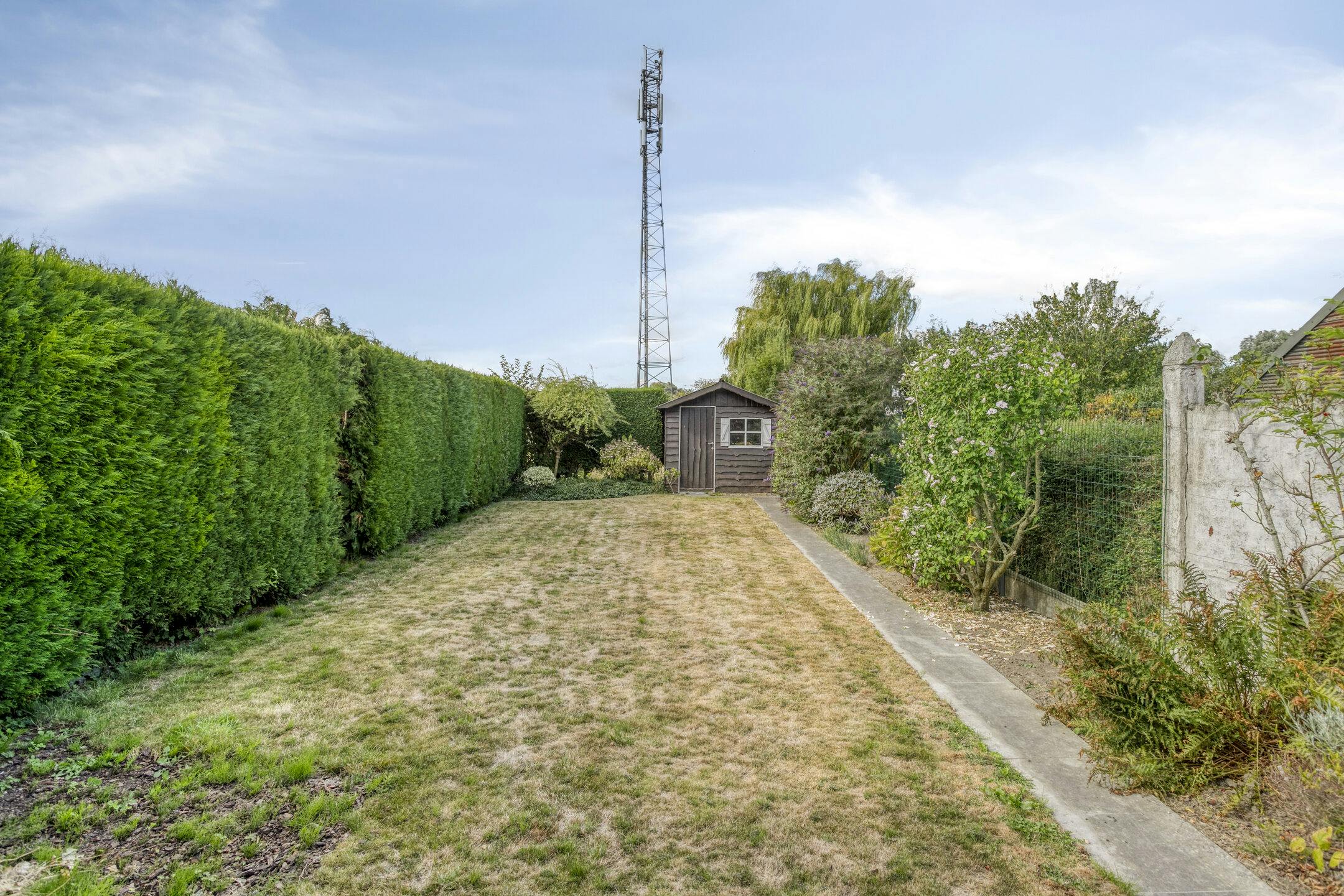 Karaktervol huis met zonnige tuin, 3 slaapkamers én garage met uitweg foto 18
