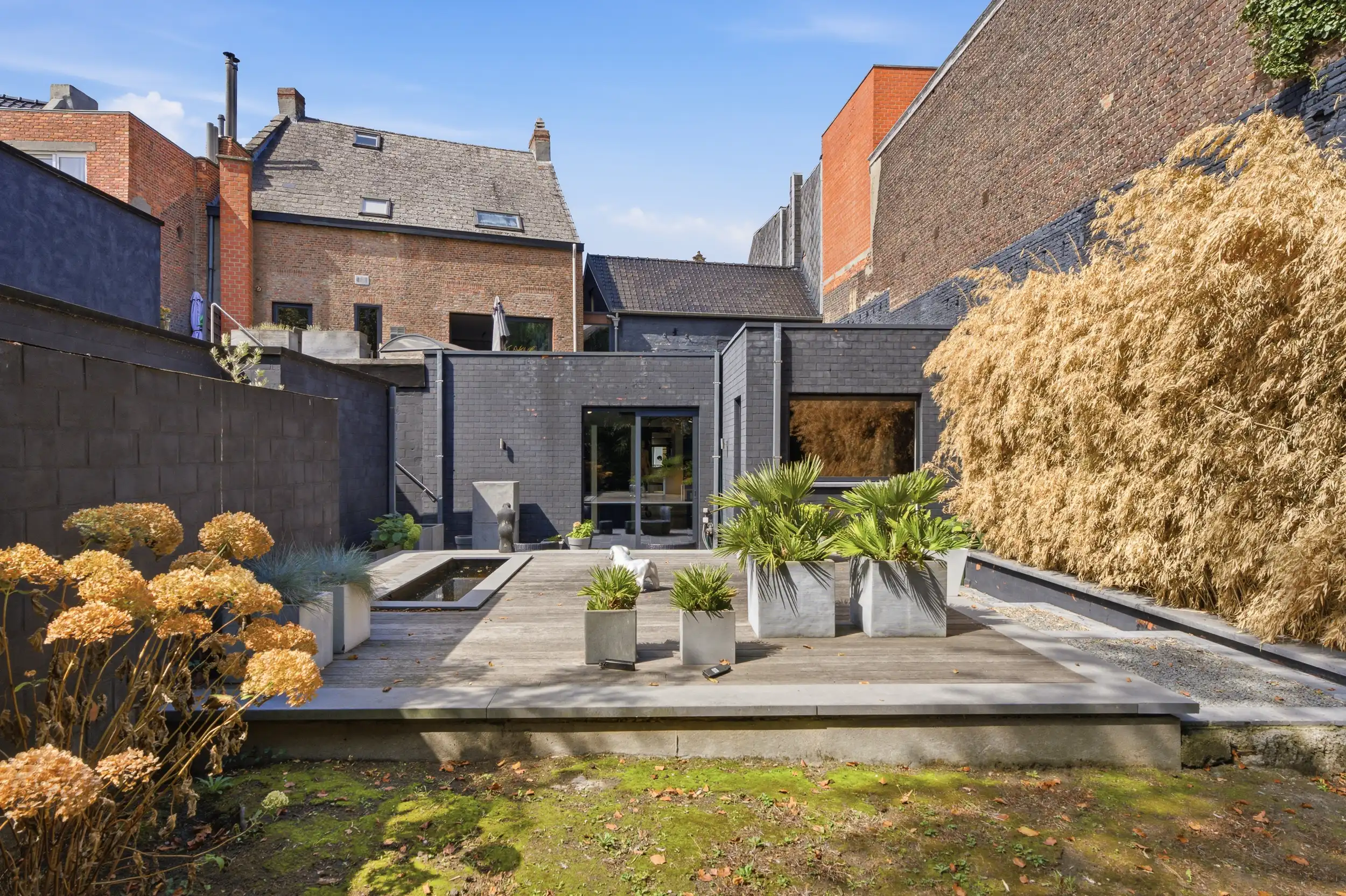 Uniek handelspand met duplex app. en tuin in hartje Wetteren foto 23
