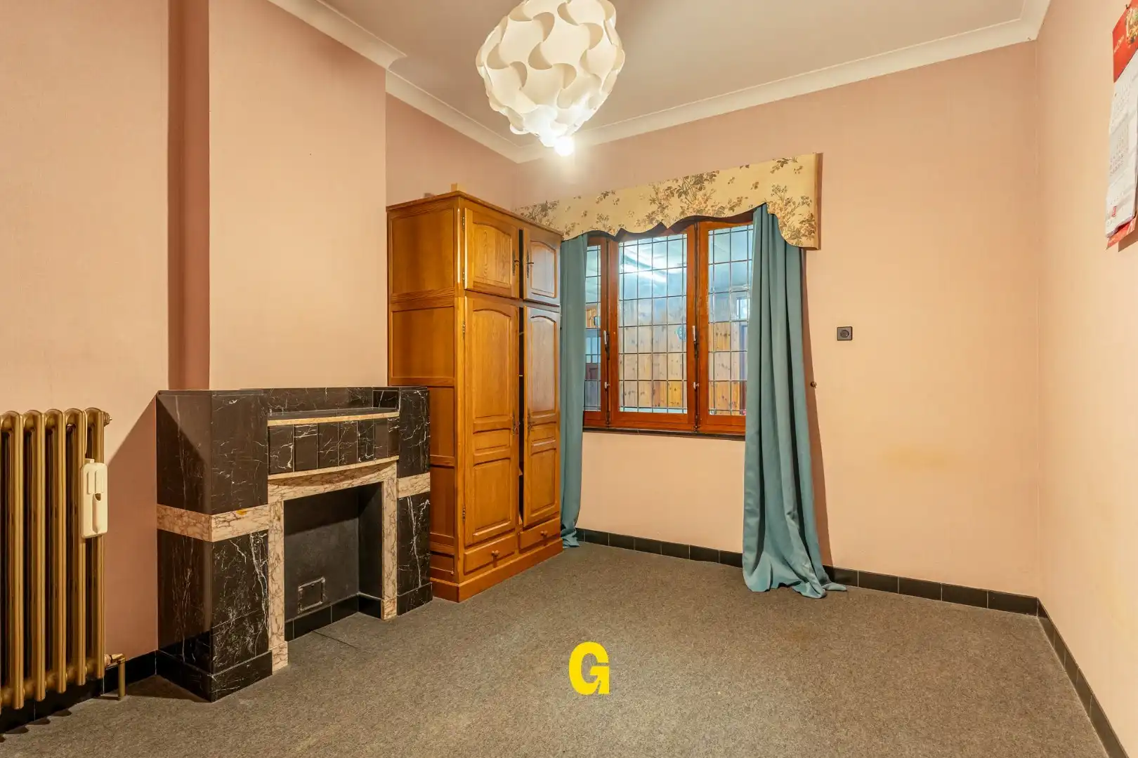 Te renoveren woning met 3 slaapkamers, inpandige garage en tuin foto 4