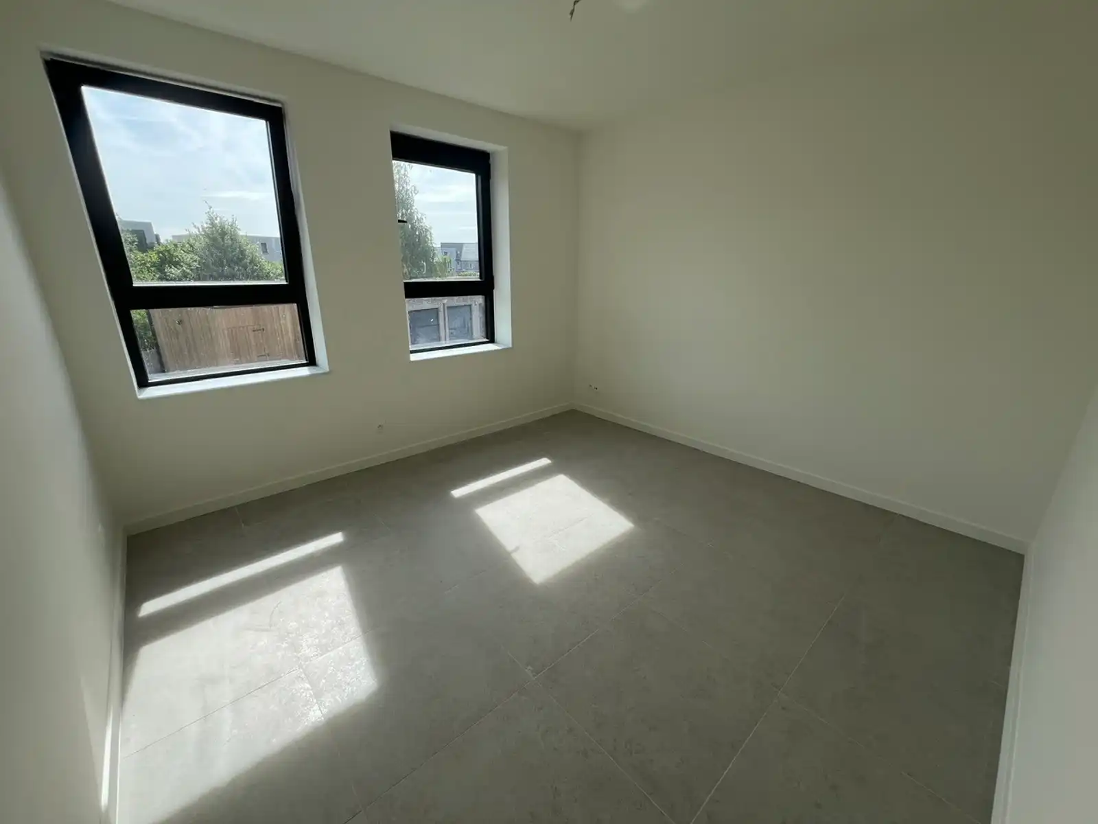 Nieuwbouwapp met 1slpk, ZW terras (26m²) en parking foto 12