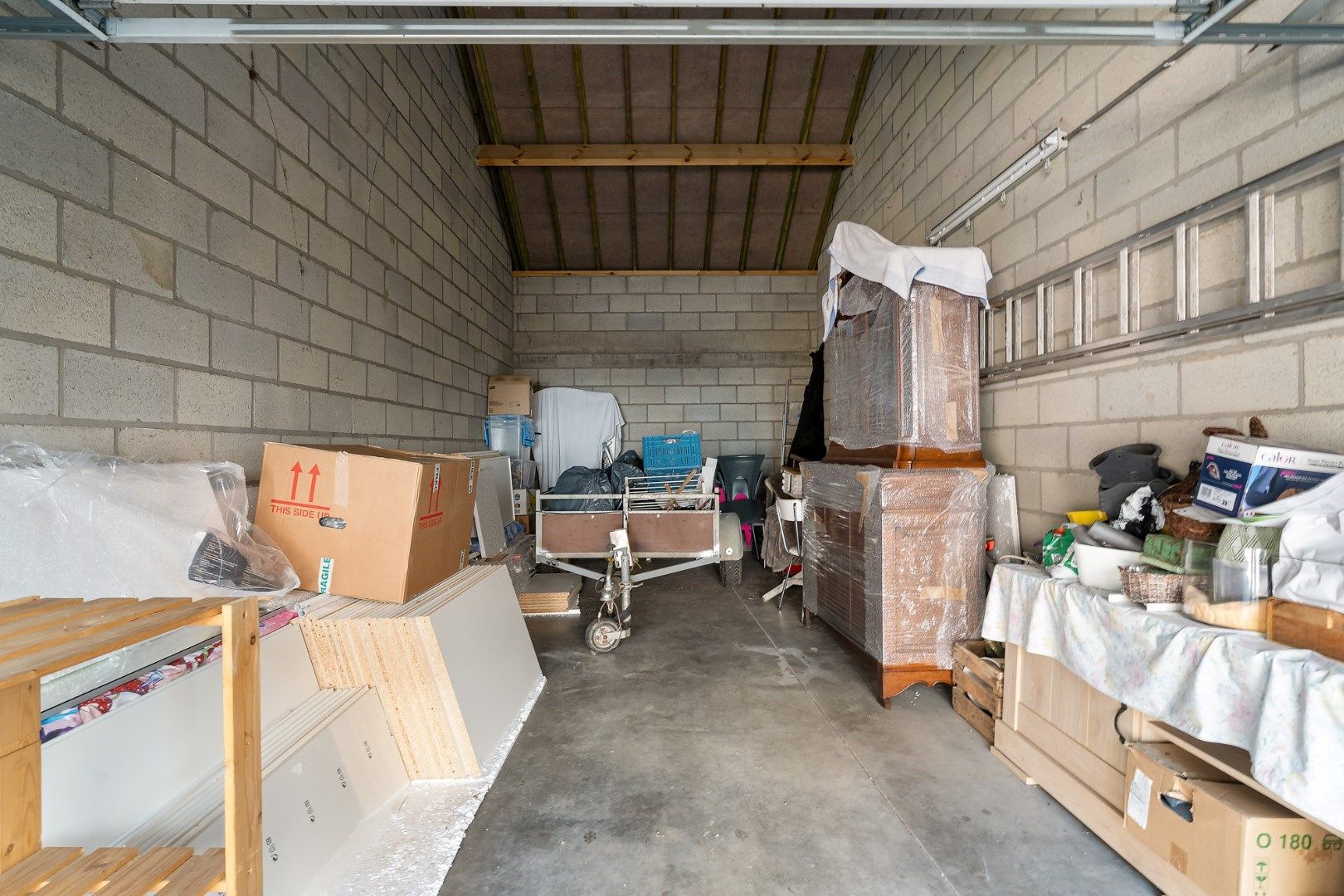 Statige herenwoning met tuin, herbestemd tot meergezinswoning met twee wooneenheden en garages in het centrum van Hoeselt foto 18