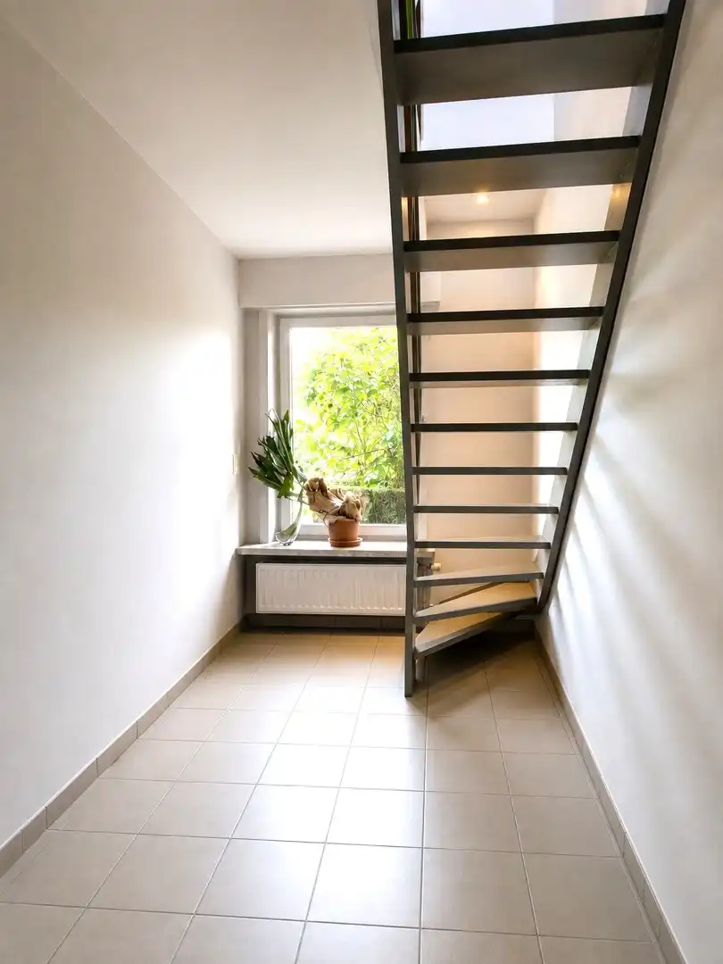 Exclusief wonen & ondernemen: imposante villa met volwaardige praktijk en aparte toegang op commerciële topligging, een perceel van 1.139 m² en met maar liefst 532 m² bewoonbare oppervlakte. foto 32