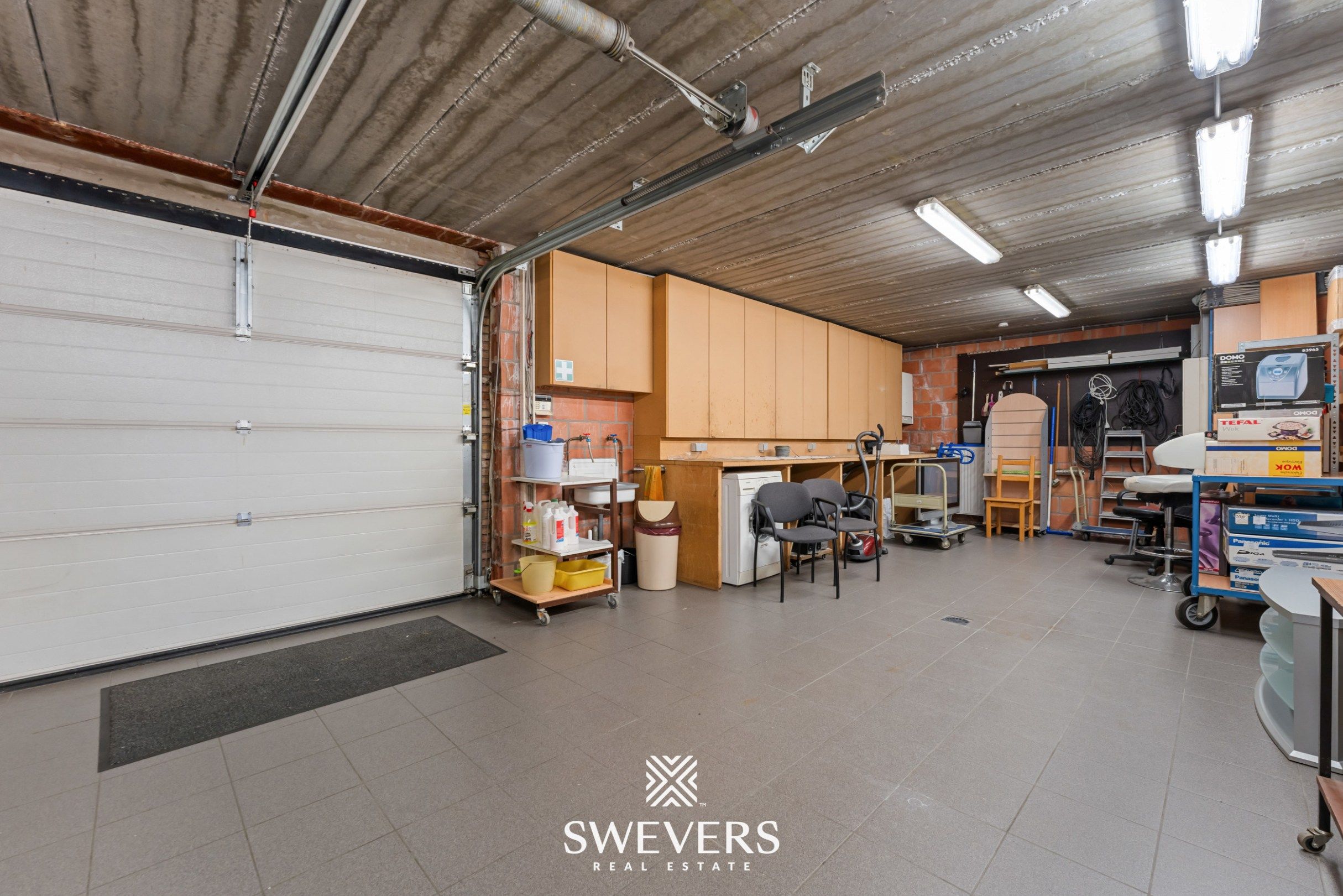 Opbrengsteigendom met handelspand, ruim appartement en uitbreidingspotentieel in hartje Heusden-Zolder foto 10