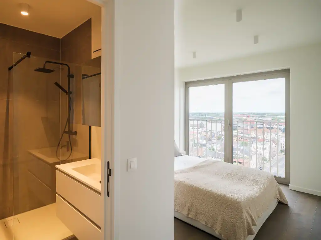Penthouse met twee volwaardige slaapkamers en een uitzonderlijk terras met panoramisch zicht over Gent en zijn torens. foto 18