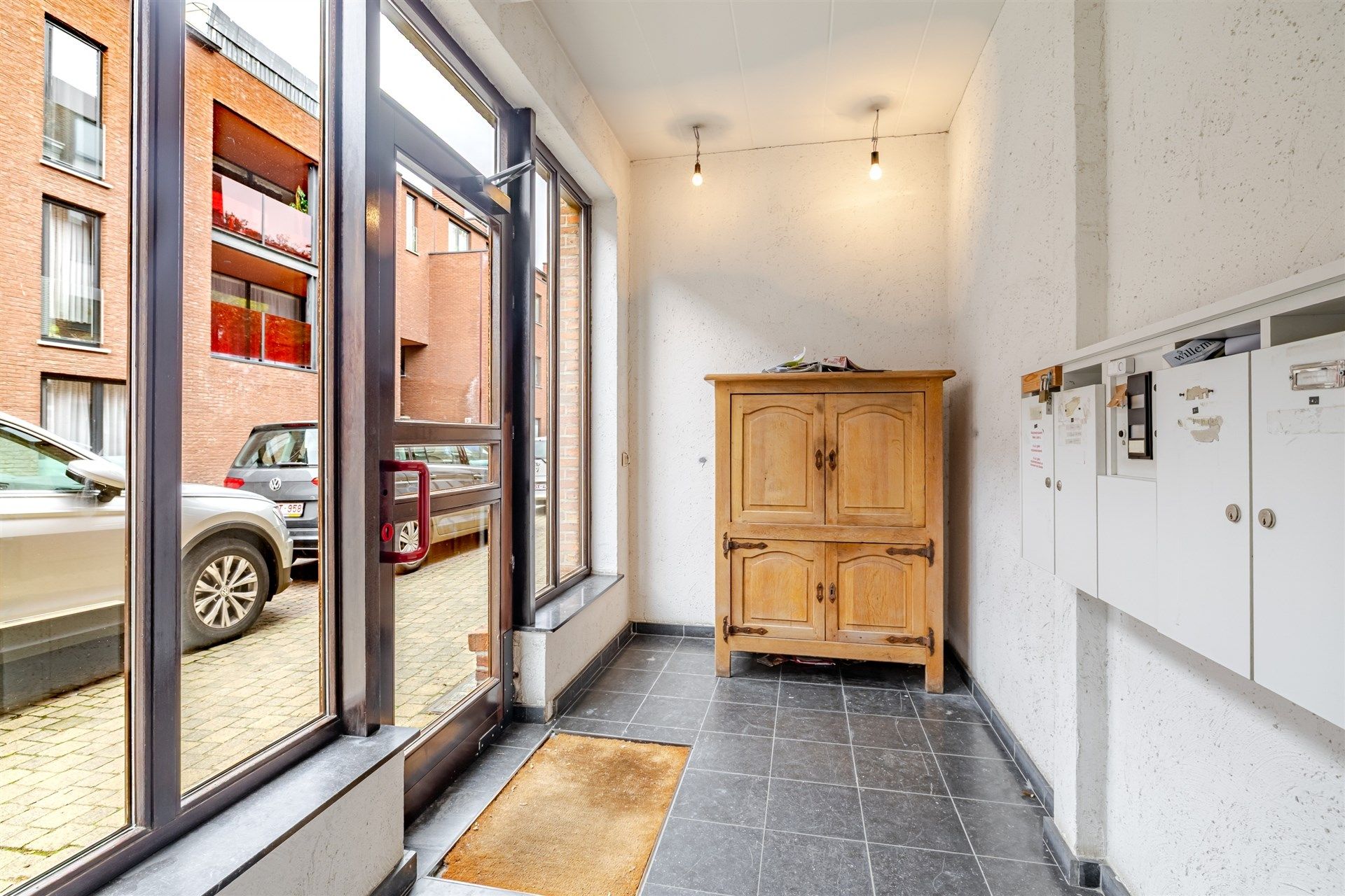 Opbrengsteigendom bestaande uit 4 appartementen + 22 garageboxen + magazijn/werkplaats foto 18