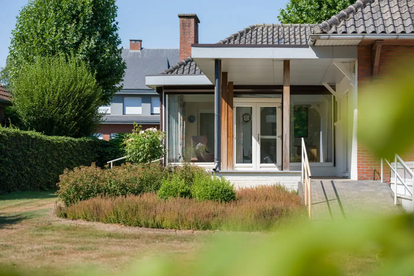 Vrijstaande laagbouwwoning met 3 slpk., garage en prachtige tuin foto 28