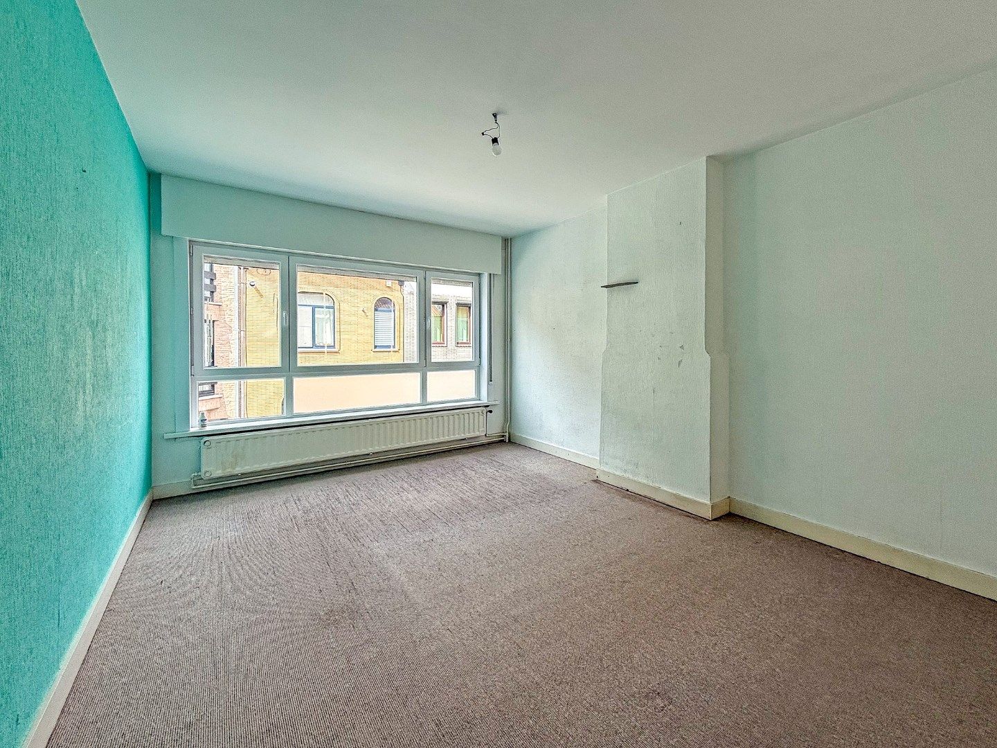 Instapklare rijwoning met garage en zonnige tuin nabij marktplein (157 m²) foto 9