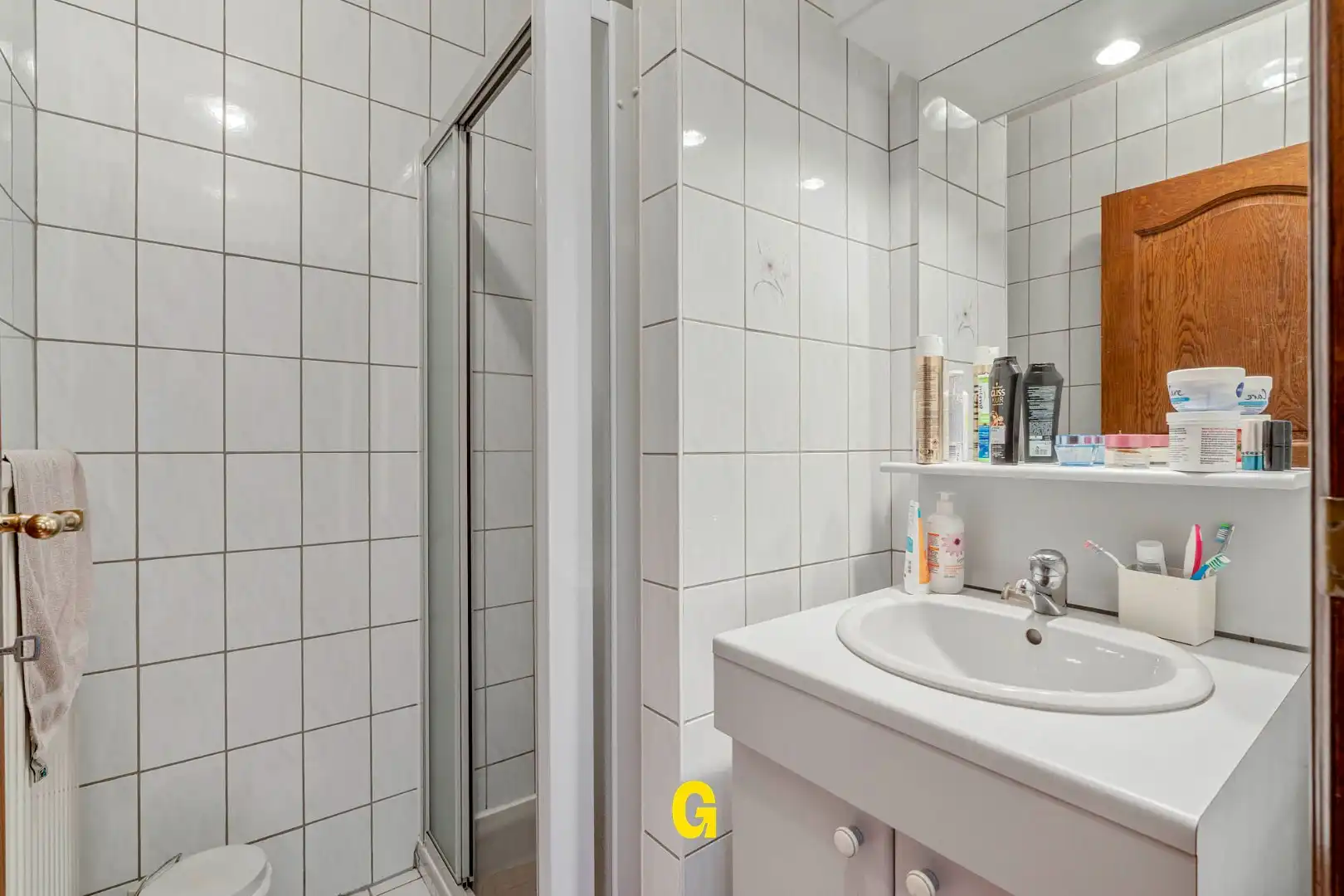 Uitstekend verzorgd 2-slaapkamer appartement in hartje Bilzen, met standplaats, kelderberging en terras met zicht op het Park van Haffmans foto 25