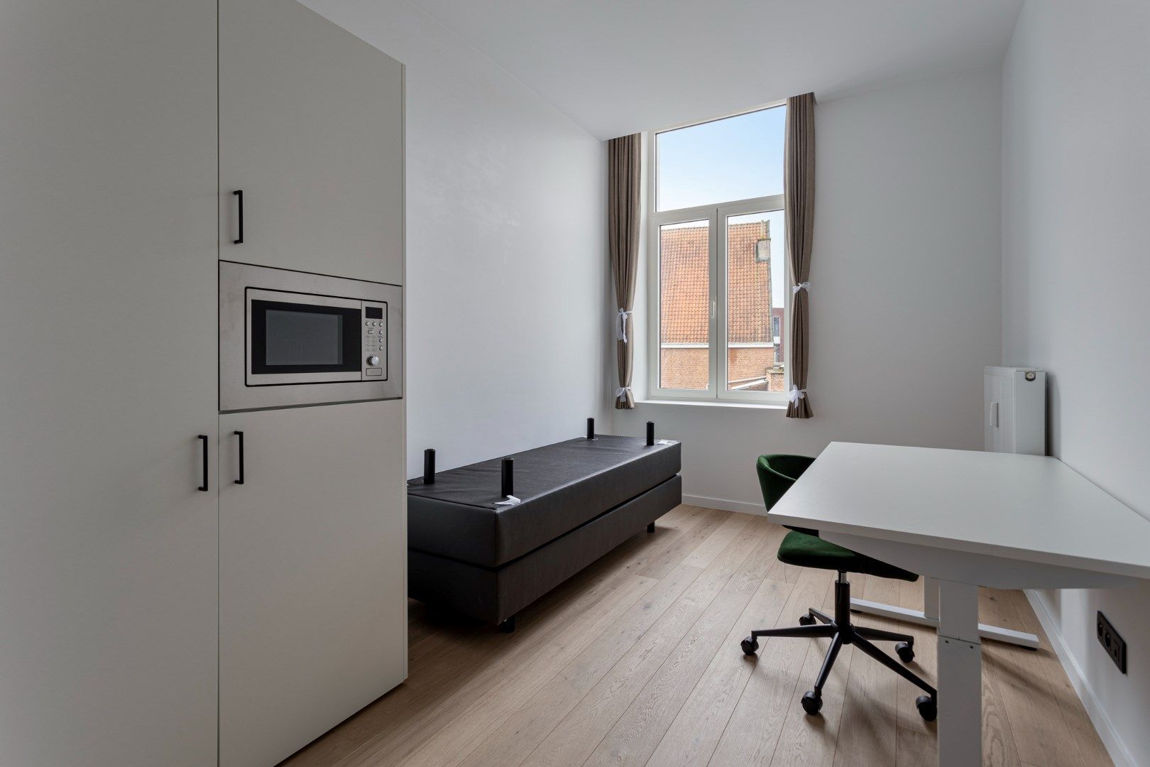 Volledig gerenoveerde studentenkamer in residentie met 29 studentenkamers met eigen sanitair in hartje Leuven  foto 9