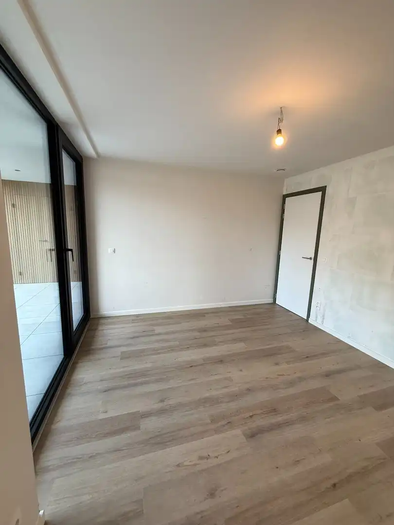 Instapklaar en energiezuinig gelijkvloers appartement met 1 slaapkamer en ruim terras te Riemst. foto 10