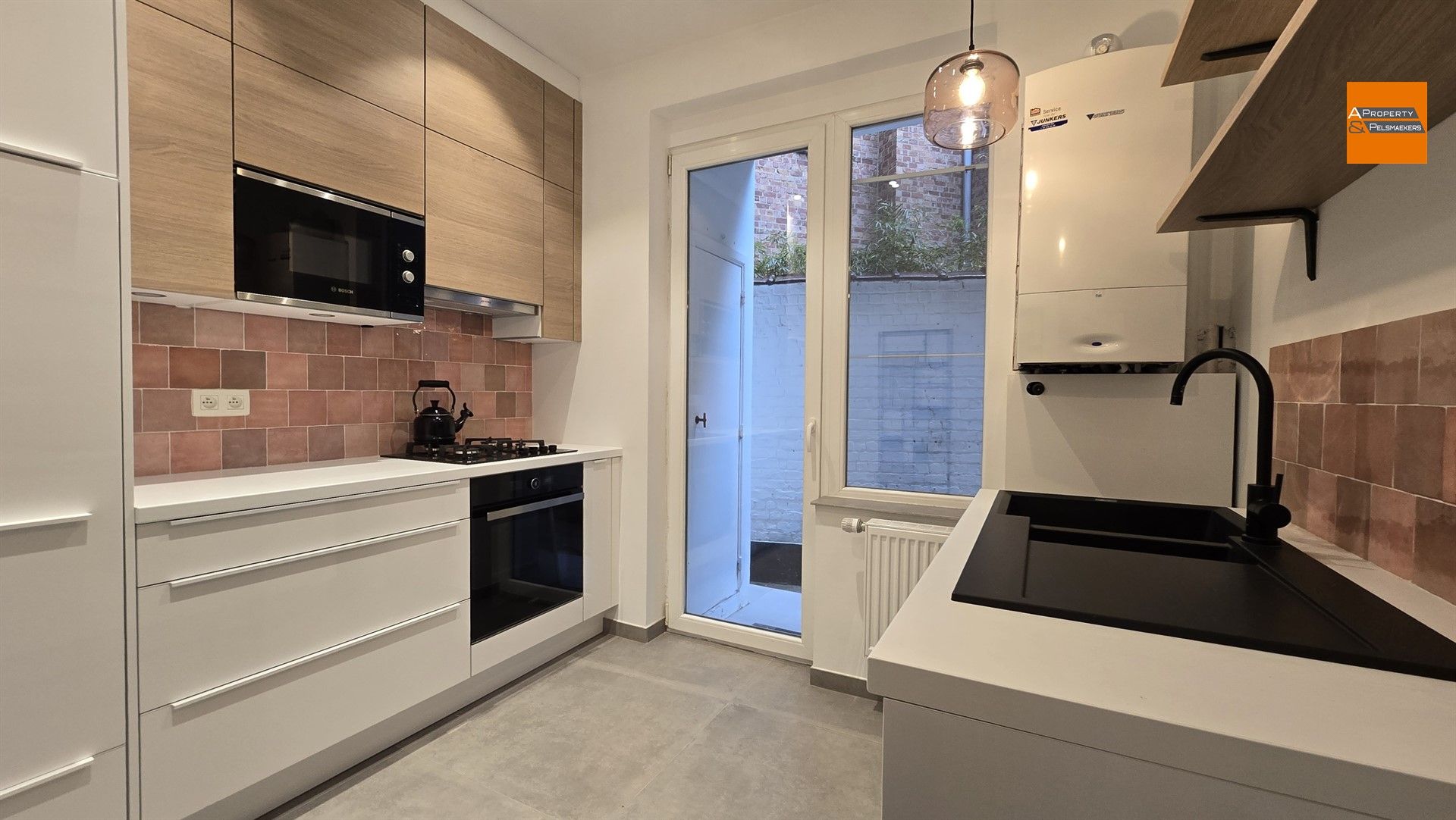 Opgefrist gelijkvloersappartement in Etterbeek foto 8