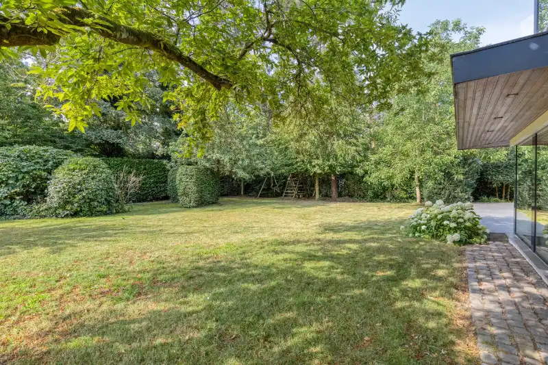 Villa met bewoonbare oppervlakte van 350m2 prachtig en rustig gelegen op perceel van 18a14 nabij het centrum van Bonheiden. foto 7