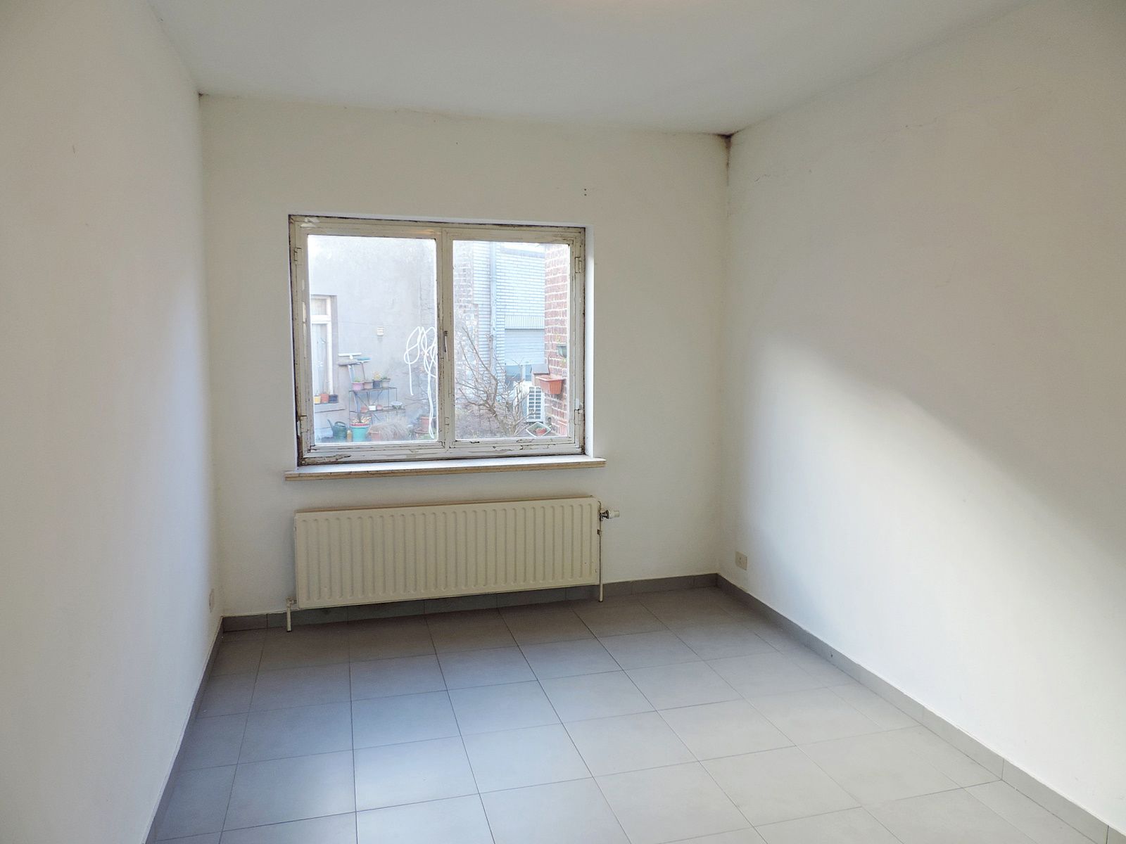 Opbrengsteigendom met handelsgelijkvloers en 2 appartementen foto 8