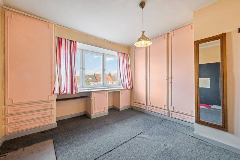 Ruime te renoveren rijwoning met zeer veel mogelijkheden en tuin foto 7