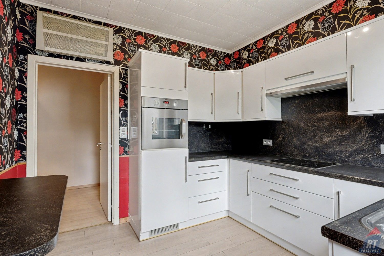 Gelijkvloerse halfopen woning met tuin en renovatiepotentieel in het hart van Sint-Truiden foto 6