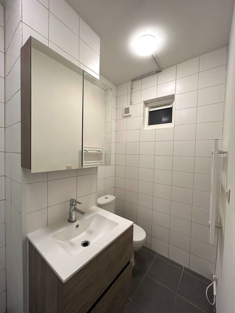 Instapklaar gelijkvloers 1-slaapkamerappartement met ruim terras in Leuven foto 11