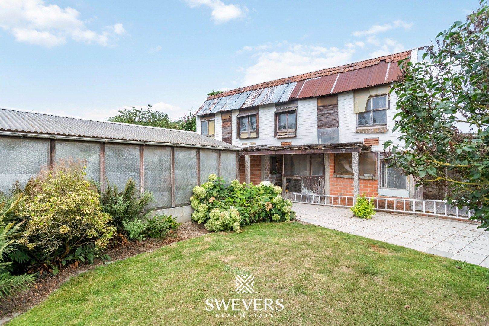 Te renoveren woning met grote tuin in hartje Wellen foto 24