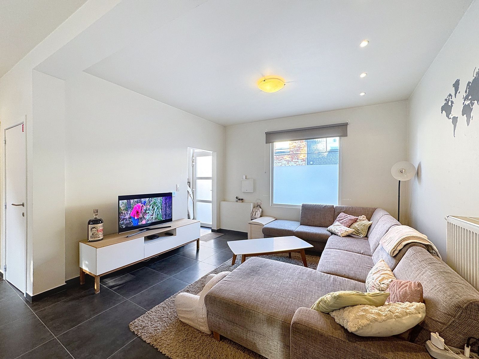 Instapklare stadswoning met 3 ruime slpk en zonnig terras! foto 2