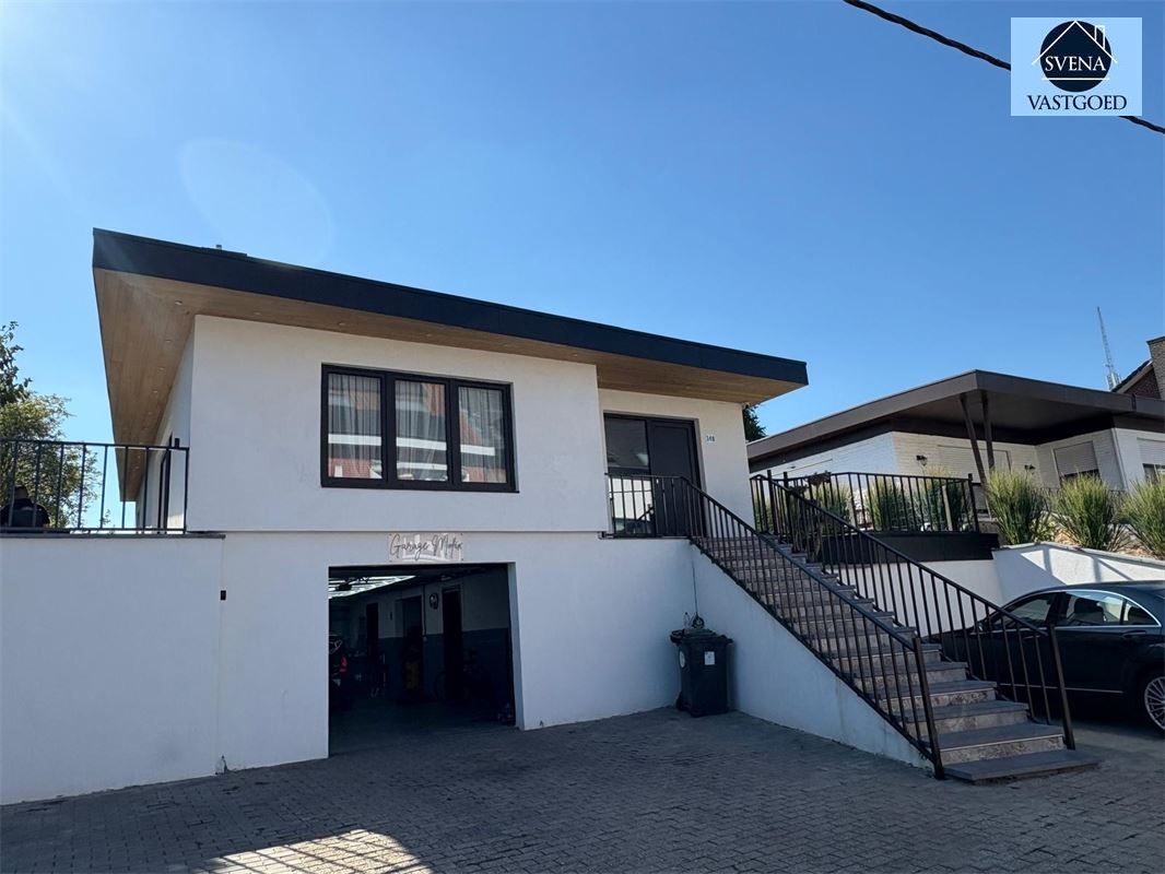 WONING MET HANDELSRUIMTE EN 3 SLAAPKAMERS foto {{pictureIndex}}