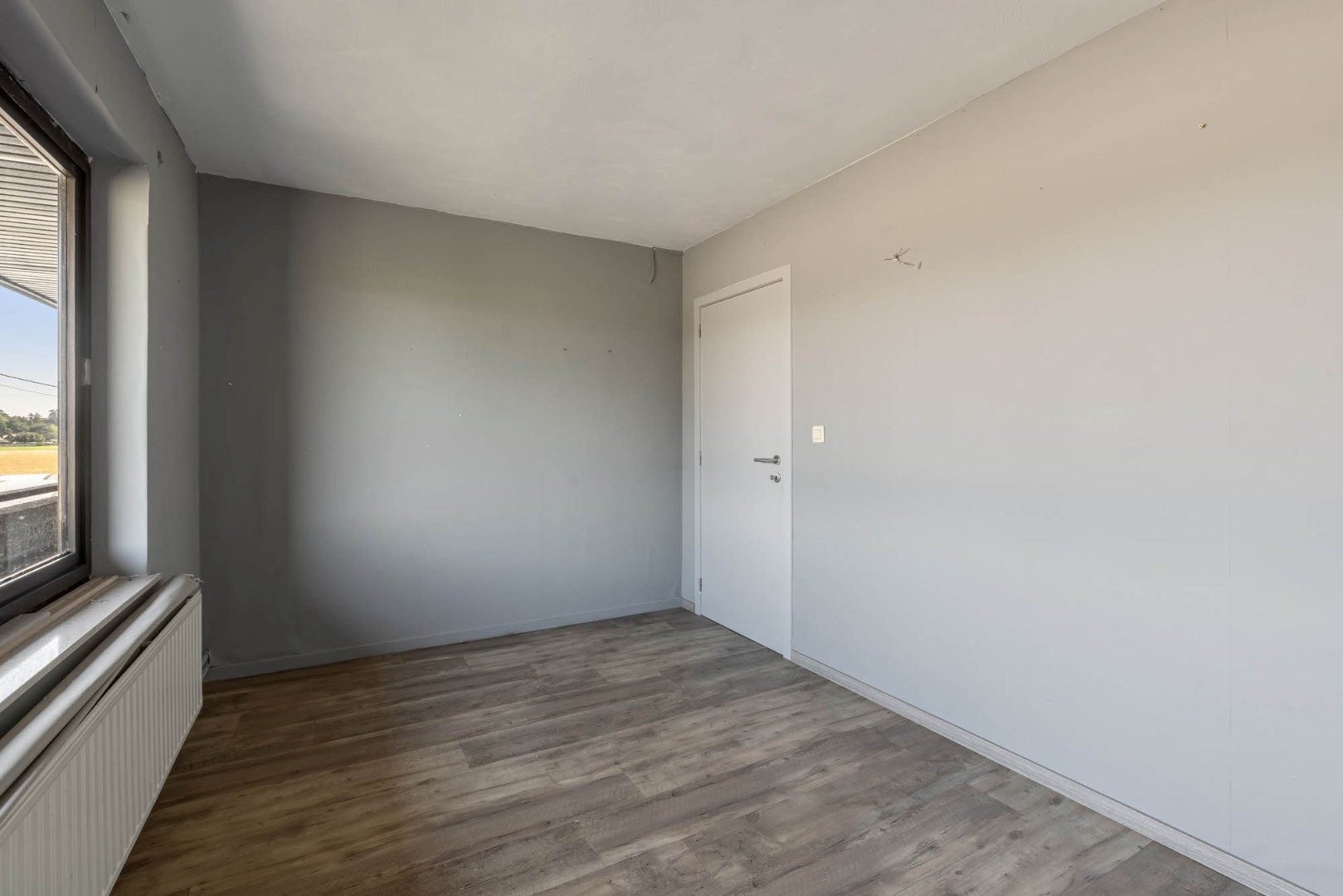 Multifunctioneel gebouw bestaande uit een woning, een winkel en een magazijn/werkplaats gelegen op een rustige locatie te Voorshoven! foto 24