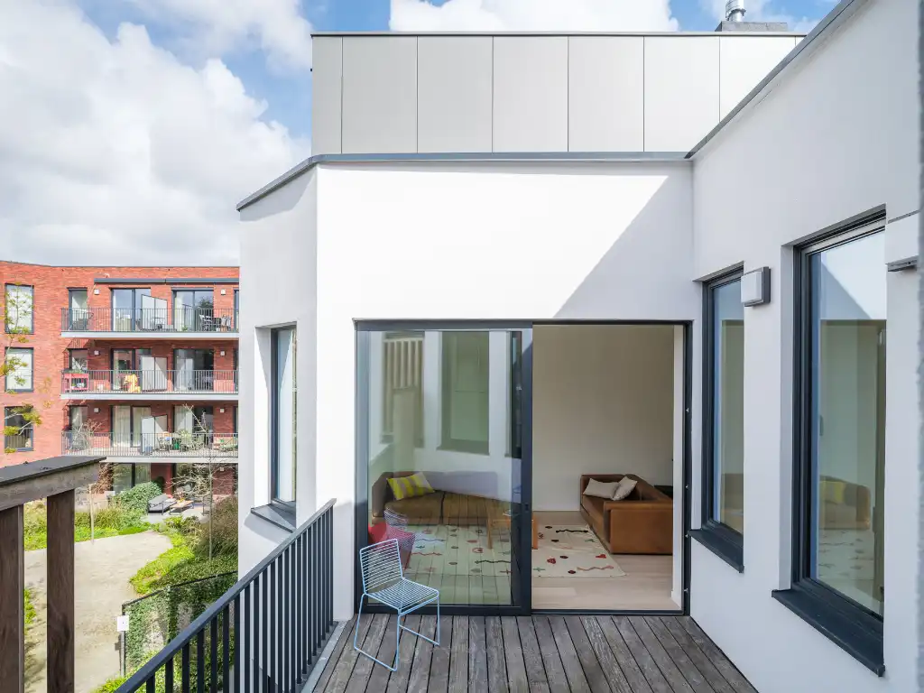 Uniek townhouse-appartement met o.m. 4 slaapkamers, 3 badkamer en een ruim terras. foto 4