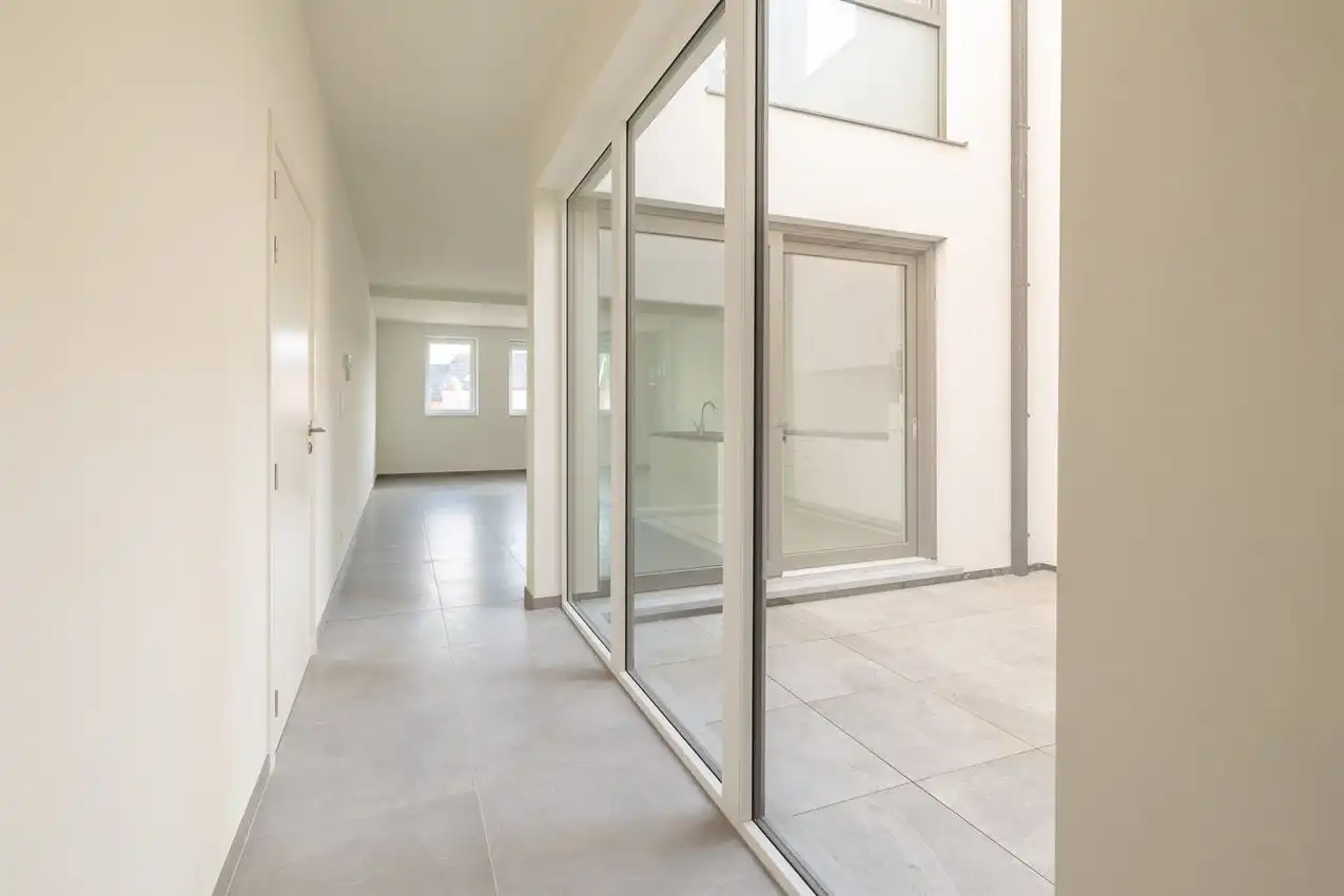 Nieuwbouwappartement met 1 slpk, autostaanplaats en terras foto 2