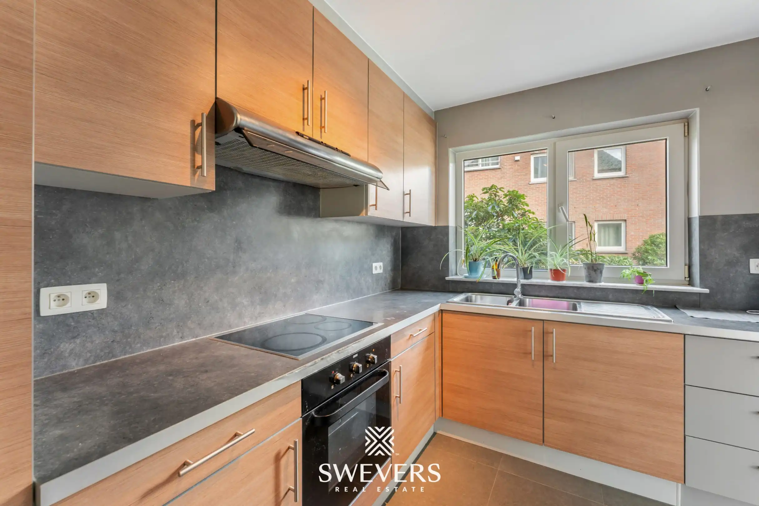 Instapklaar gelijkvloers 3-slaapkamerappartement met autostaanplaats en kelderberging nabij Hasselt-centrum foto 9