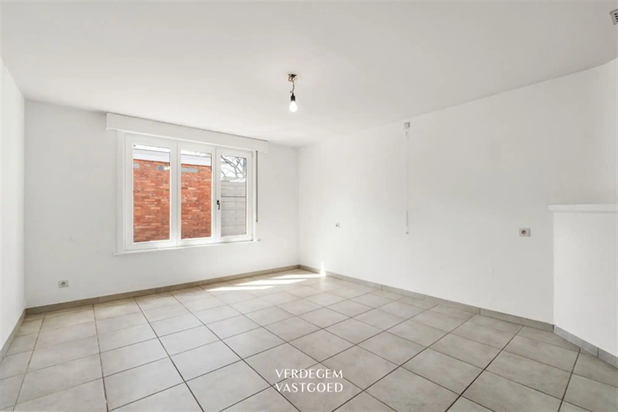 Opbrengsteigendom met 2 appartementen en 4 garages in het centrum van Sleidinge  foto 24