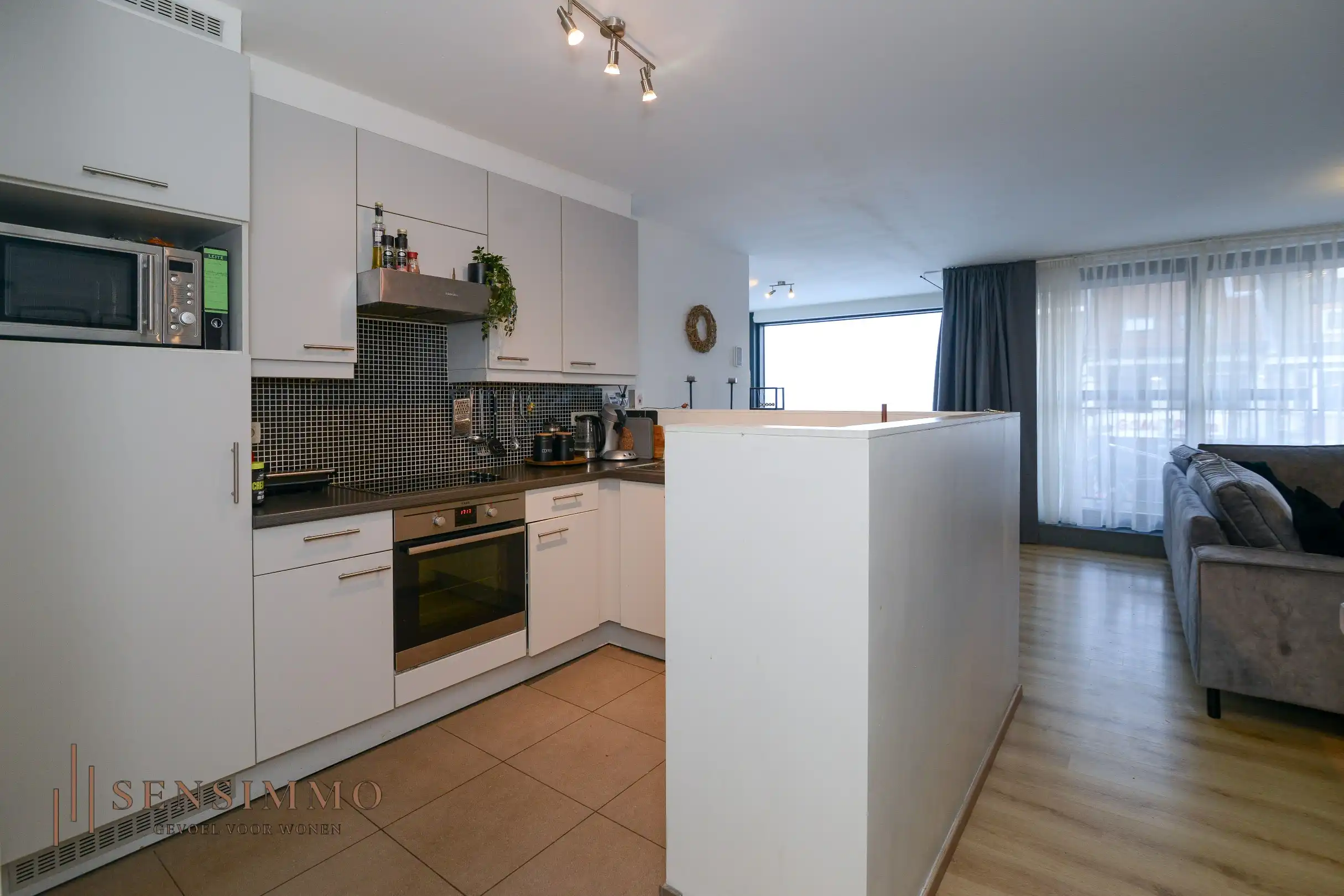 Instapklaar 2-slaapkamerappartement met dubbele terrassen en garagebox in hartje Eisden foto 9