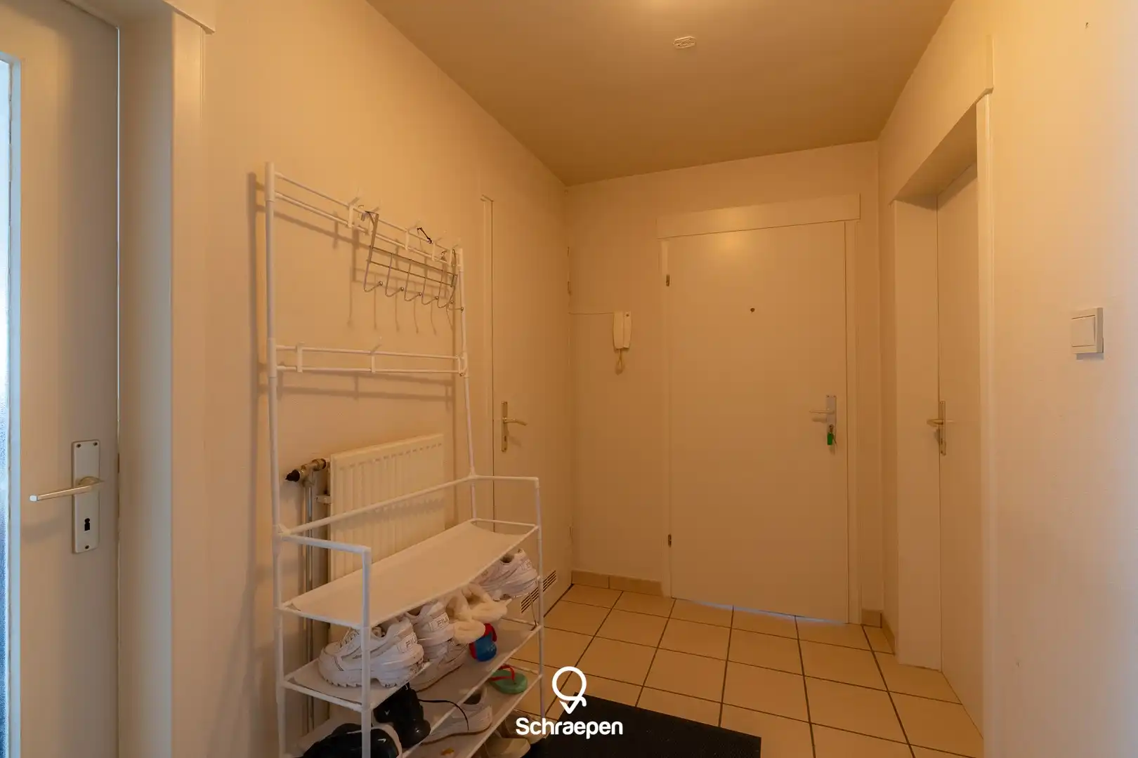 Lichtrijk gelijkvloers appartement met garagebox en privétuintje nabij Zonhoven-centrum! foto 10