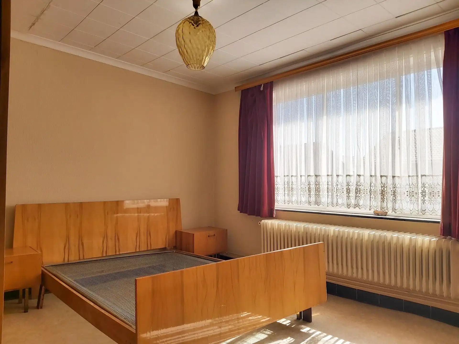 Te renoveren woning met 3 slaapkamers, garage en tuin in Maasmechelen! foto 8