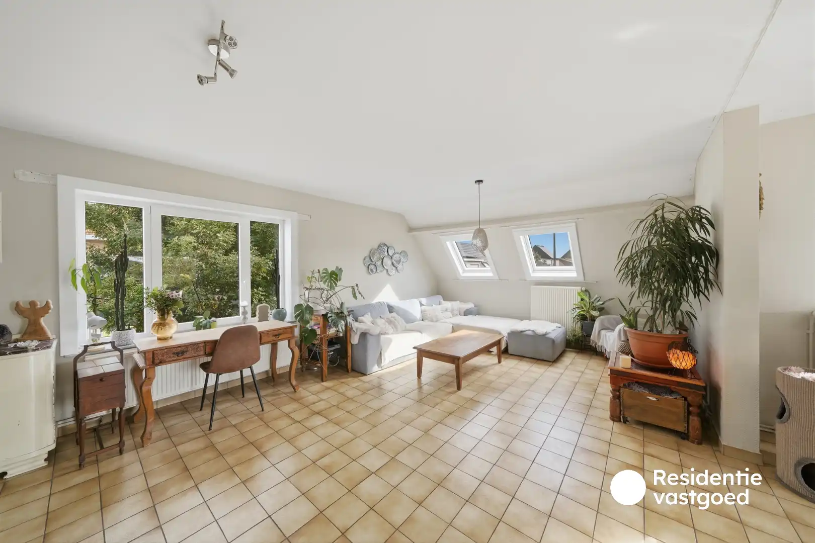 Opbrengsteigendom met 3 appartementen, garage en zonnig terras foto 4