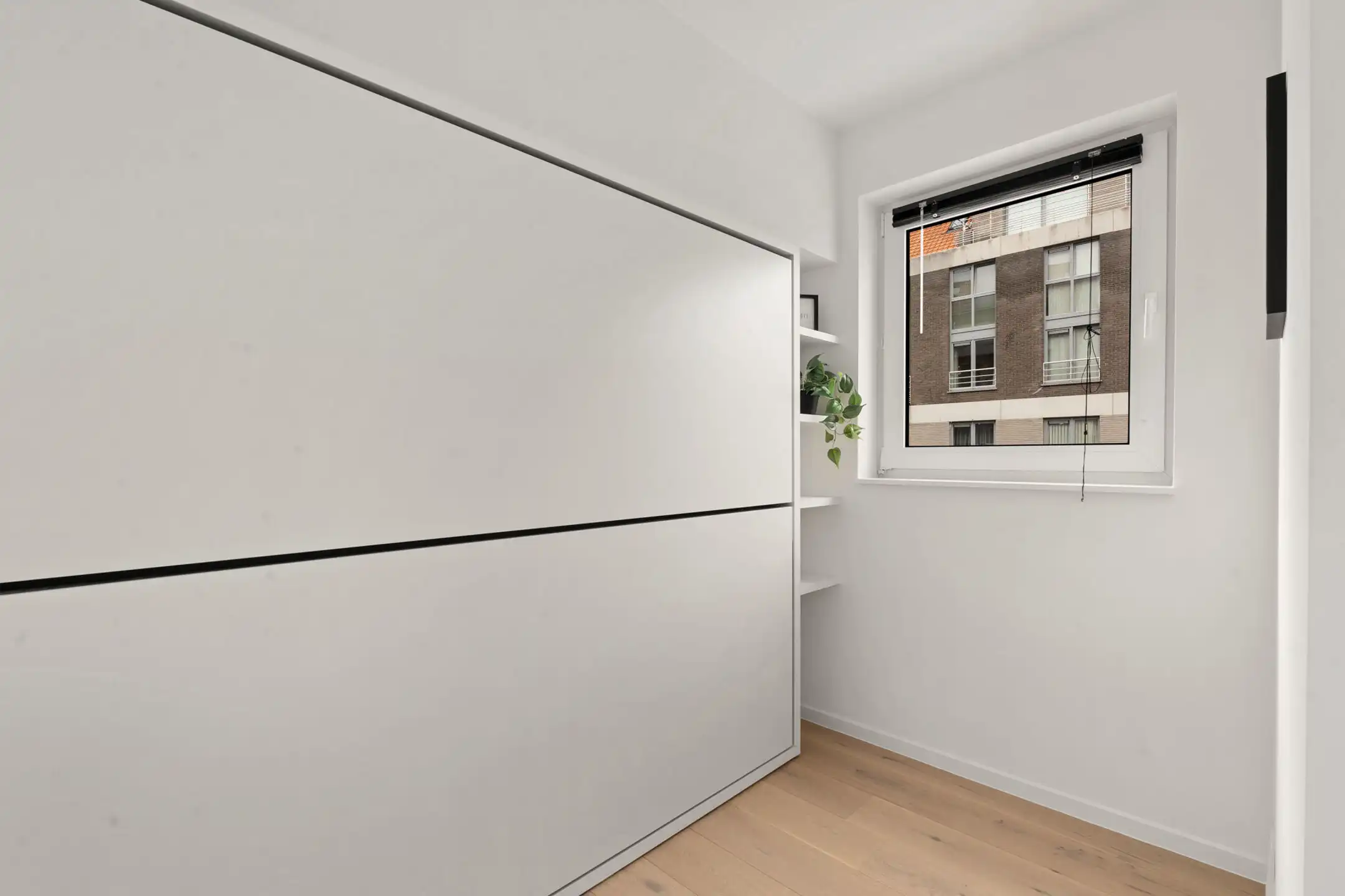 Prachtig gerenoveerd app met 2 slaapkamer centraal gelegen. foto 11