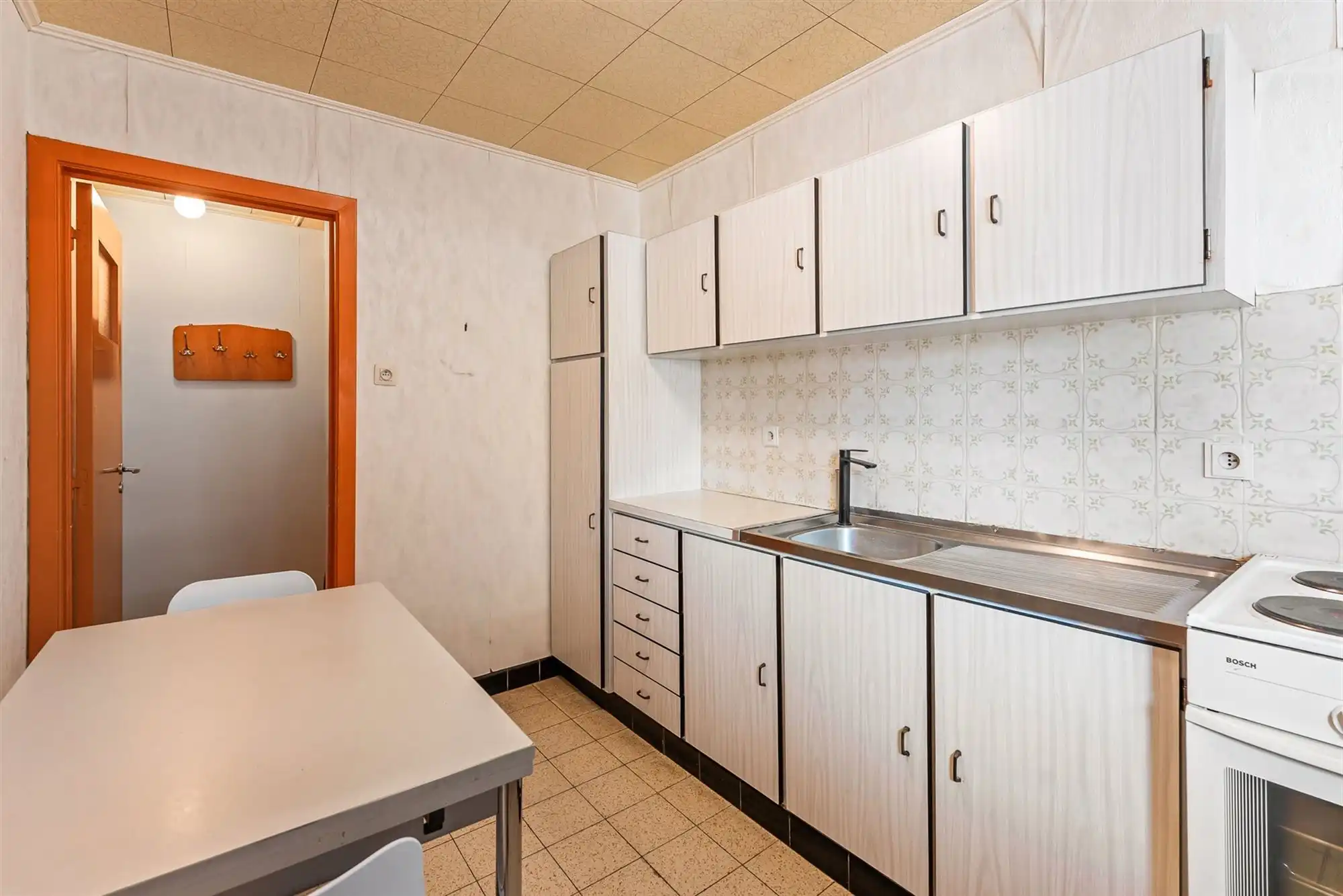 PERFECT ONDERHOUDEN WONING MET ACHTERINRIT NAAR TUIN IN BERINGEN CENTRUM foto 9