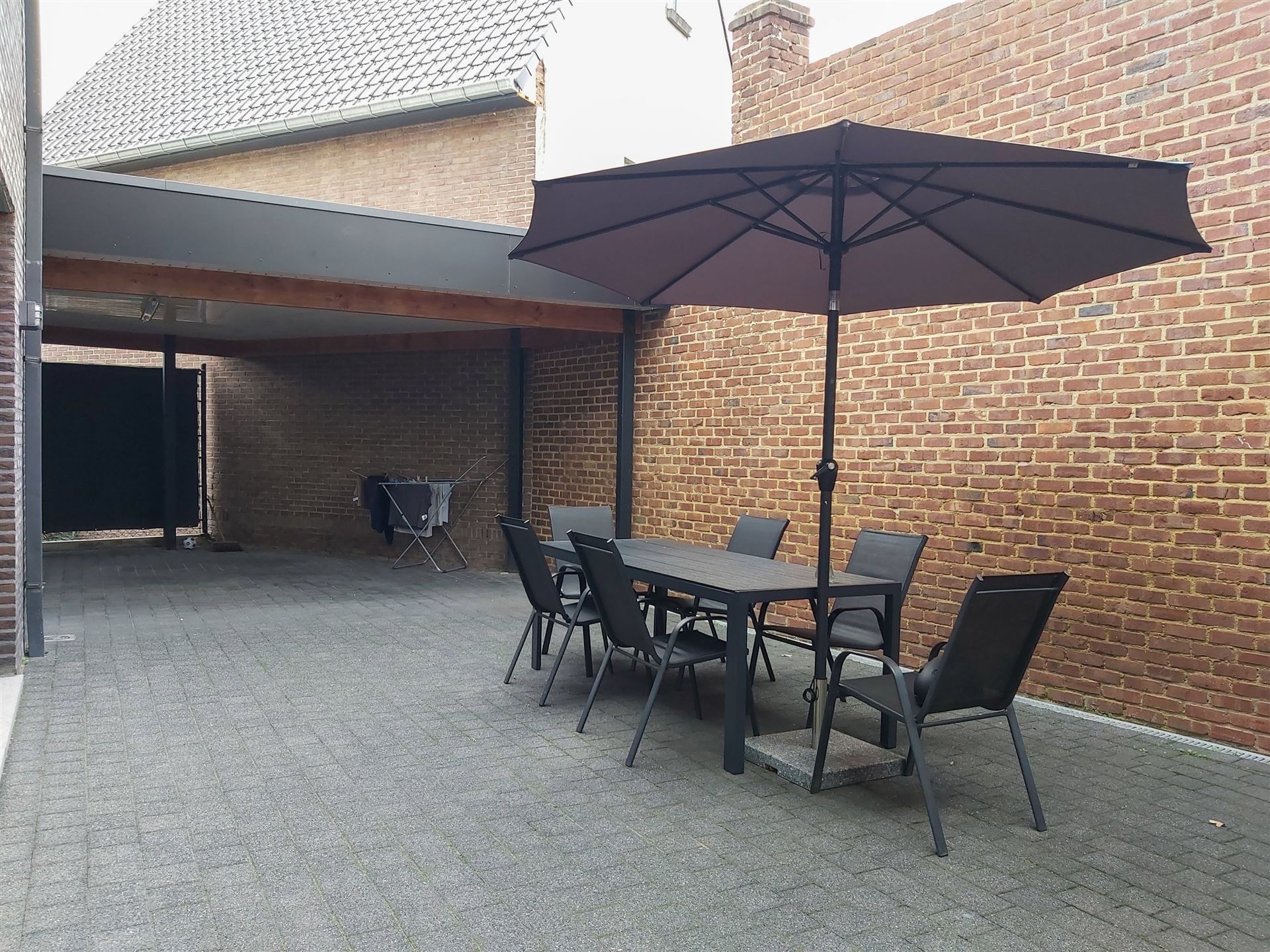 Instapklare gezinswoning met 3 slaapkamers, carport en onderhoudsvriendelijke tuin in het hart van Uikhoven! foto 13
