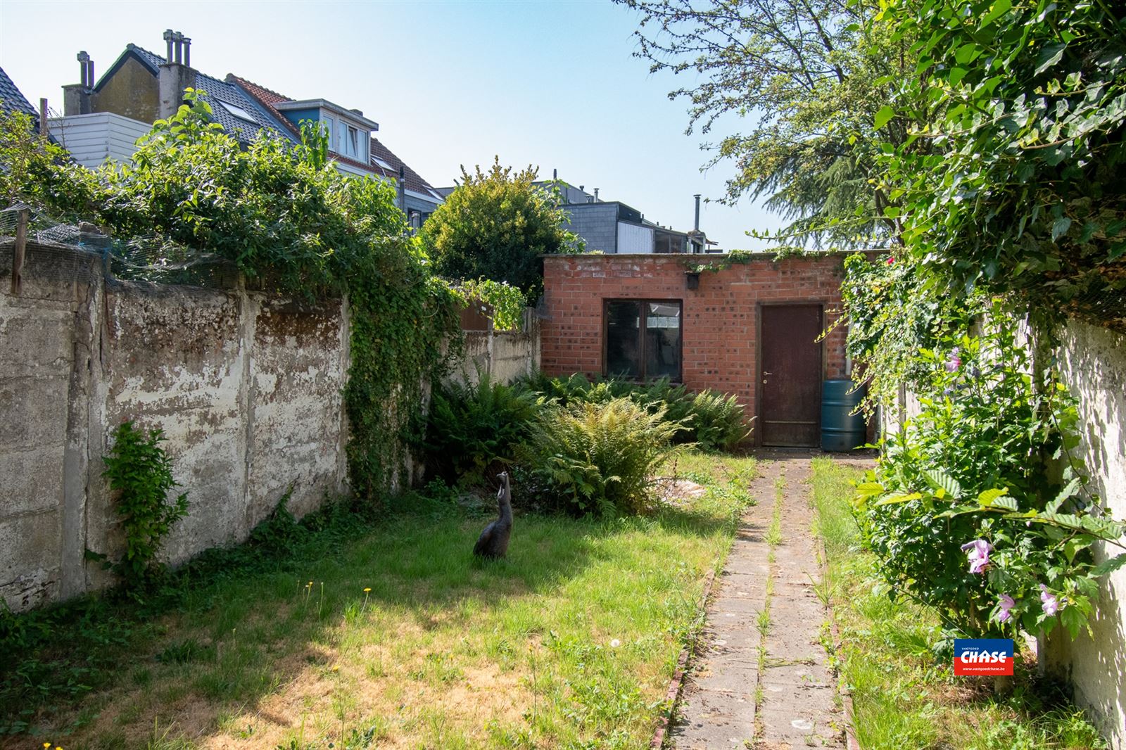 Rijwoning met 4/5 slaapkamers en tuin foto 8