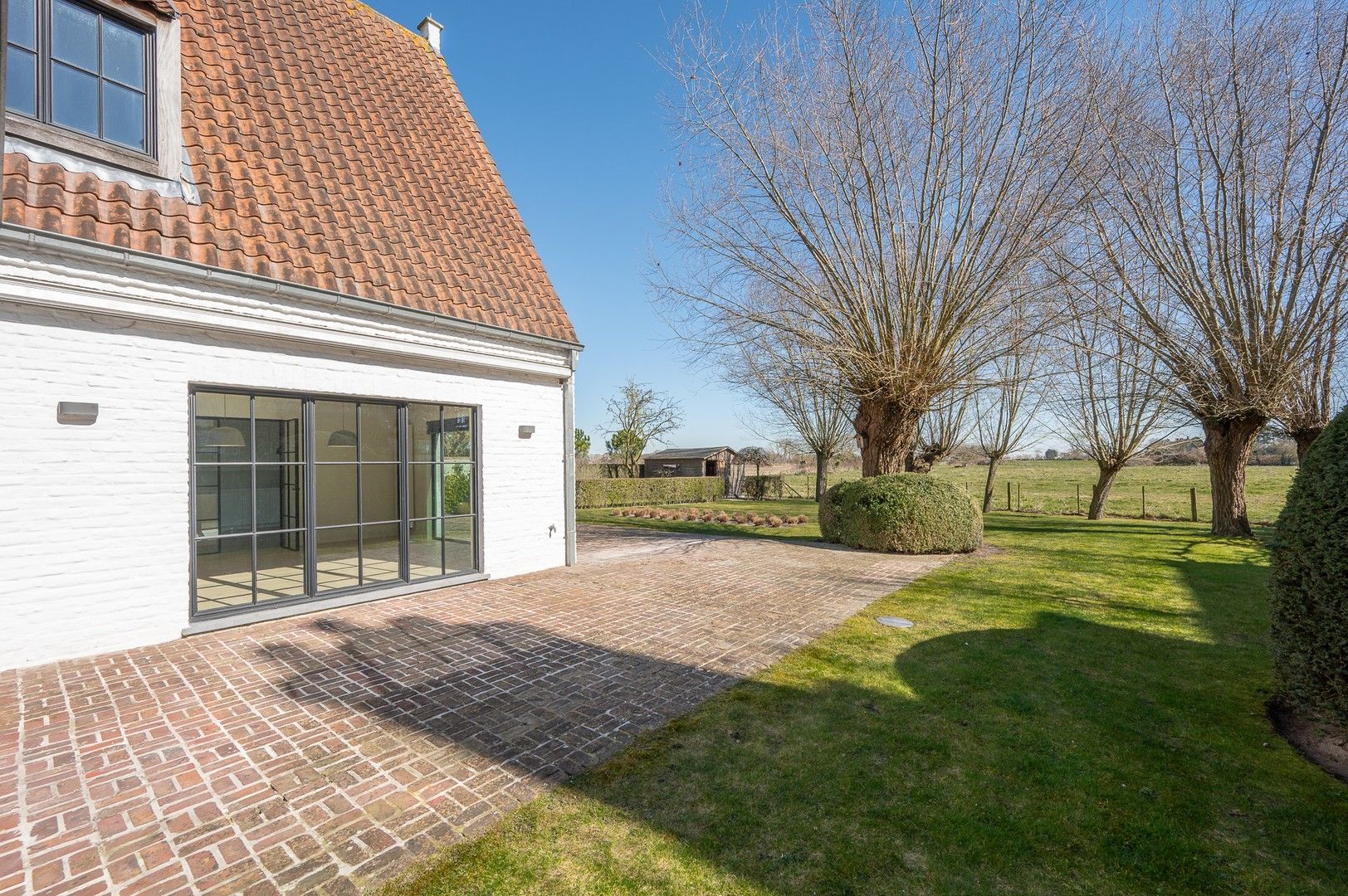 Alleenstaande villa genietend van prachtige open zichten op de polders. foto 12