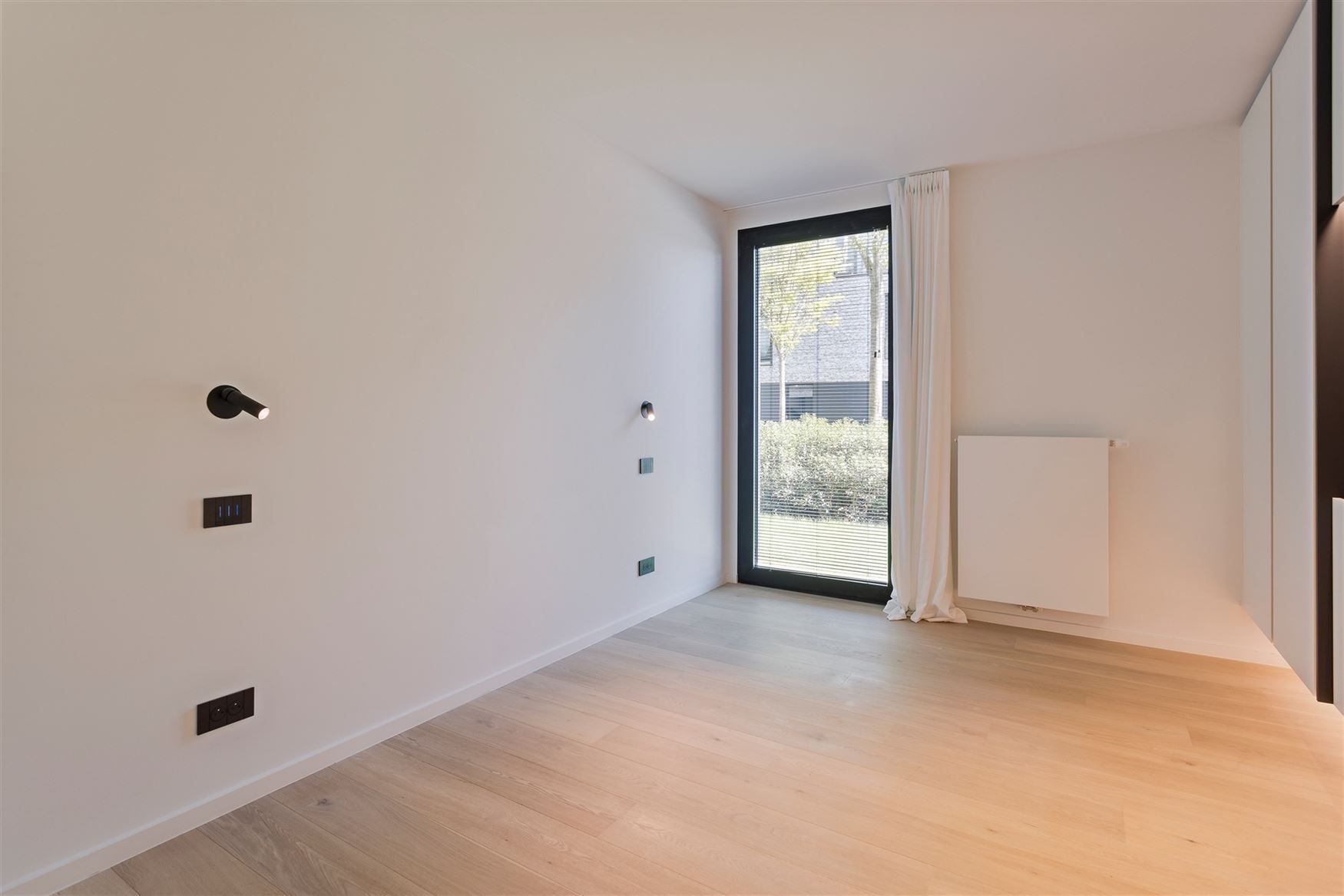 Appartement met tuin en 2 ondergrondse autostaanplaatsen foto 6