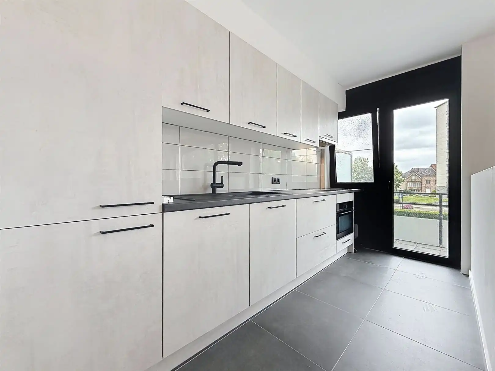 Gerenov. app met 2 slpks, 1ste V, kelder en garagebox foto 14