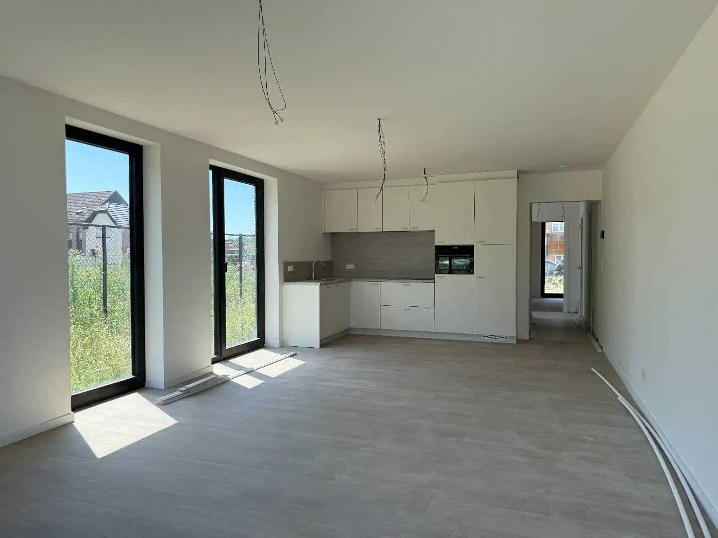 Laatste gelijkvloers 2-slpk appartement met tuin, 1 stpls en een kelder foto 3