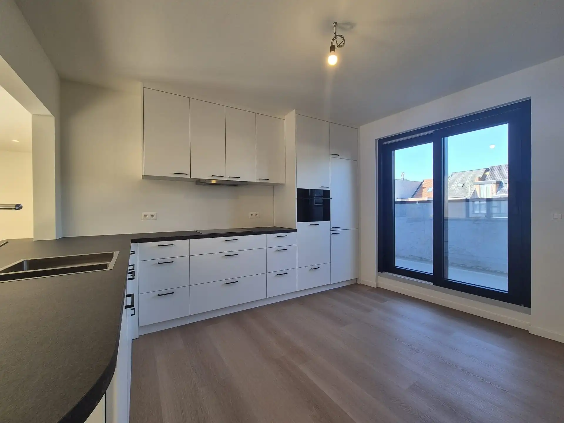 Ruim triplex appartement met polyvalente ruimte op toplocatie in het hart van Wetteren foto 9