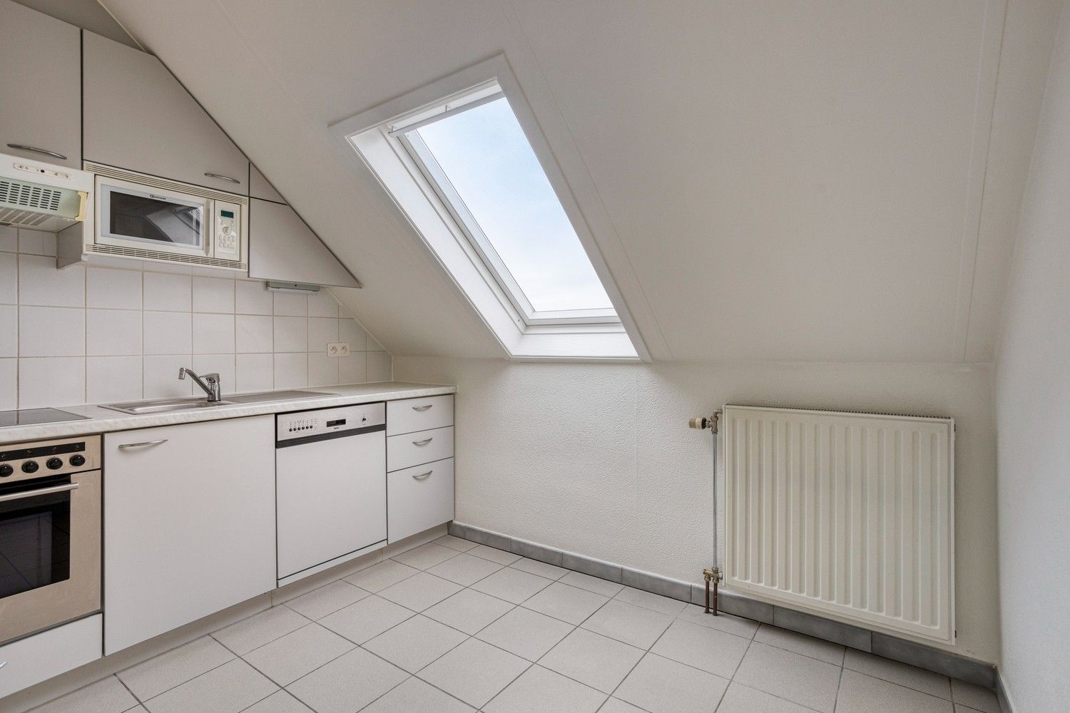 Ruim duplex-appartement met 3 slaapkamers in het hart van Gellik foto 9