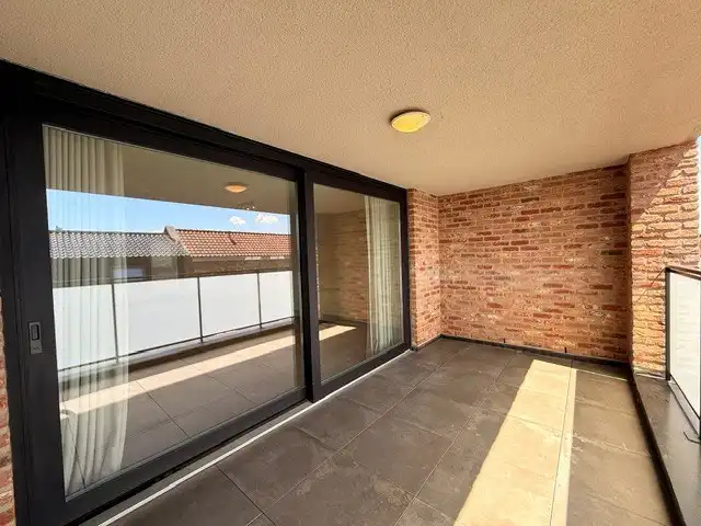 Luxe duplexappartement te huur in het hart van Maaseik, met lift, 2 slaapkamers en 2 terrassen.  foto 13
