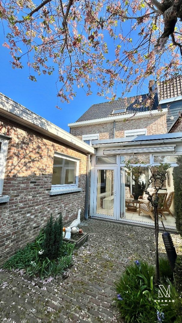 Ruime centrumwoning met 4 slaapkamers, veranda, zij-ingang en stadstuin foto 2