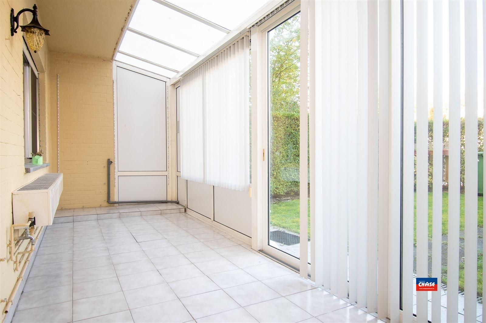 Gelijkvloersapp. met 2 slpks, tuin + garage foto 10